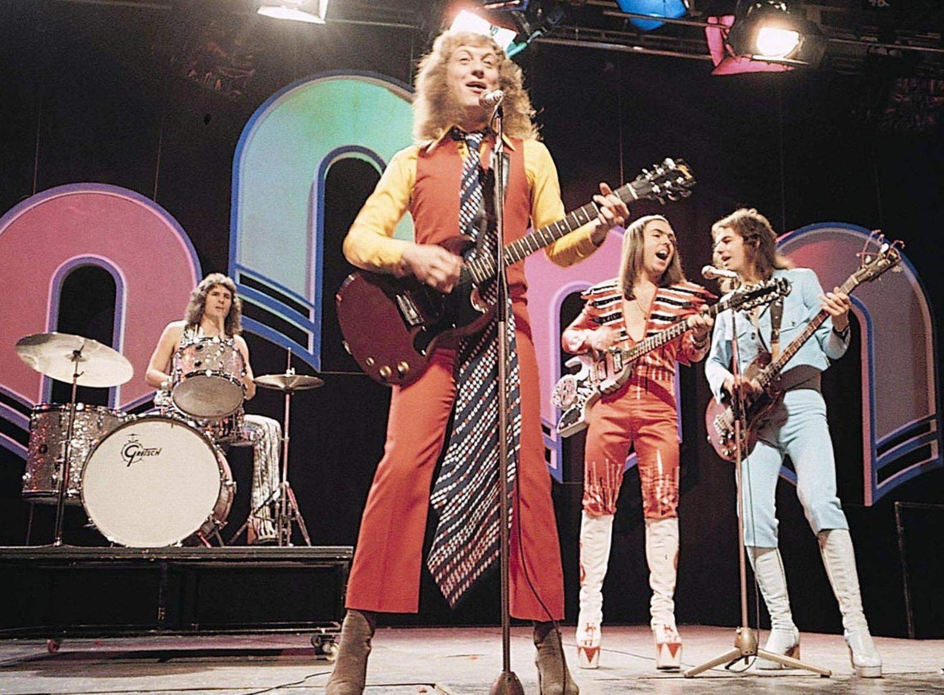 Slade 2021. Рокеры 70-х. Группы 60-х. Пит таунсенд, лидер рок-группы the who. Рок 60 70 80.